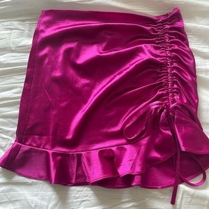 Pink/fuchsia mini skirt, size small.